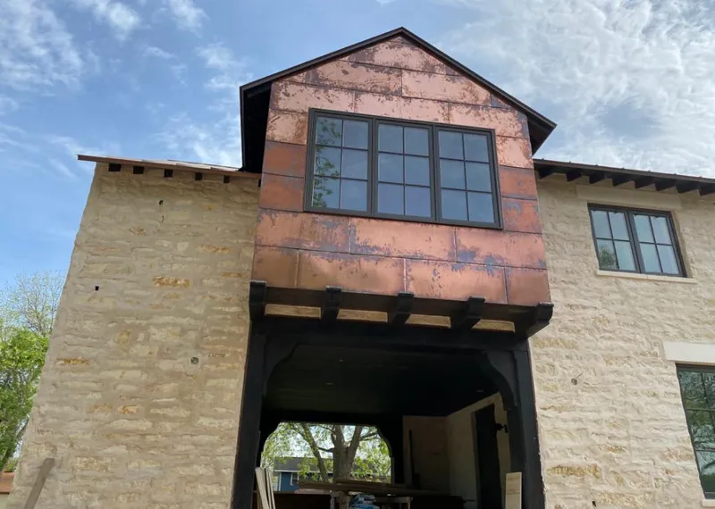 Copper metal panel facade on a stone building for Roof Repair in Santa Clara